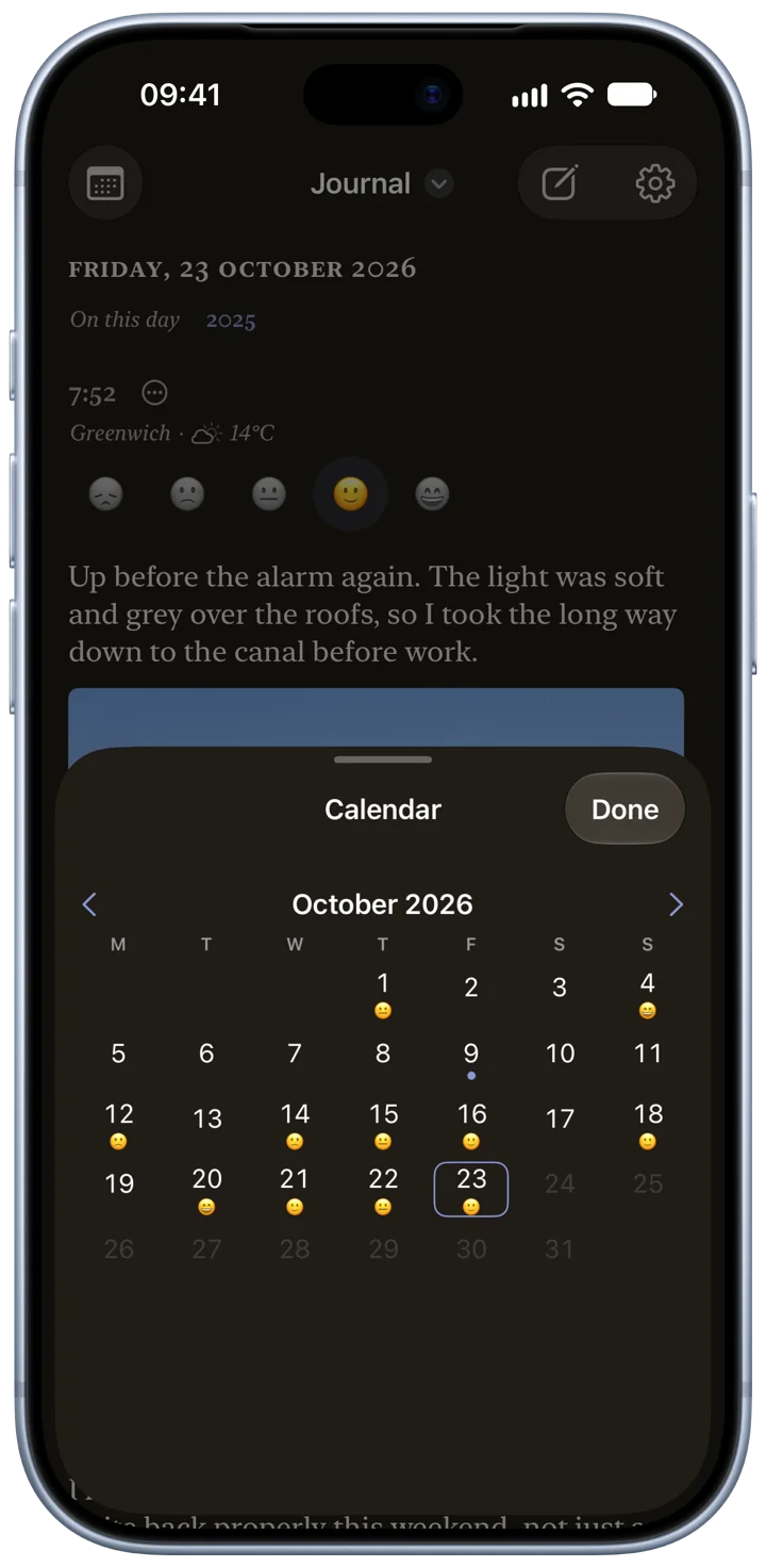 Bifolio’s calendar in Dark Mode on an iPhone: October 2026, with the days that hold an entry marked.