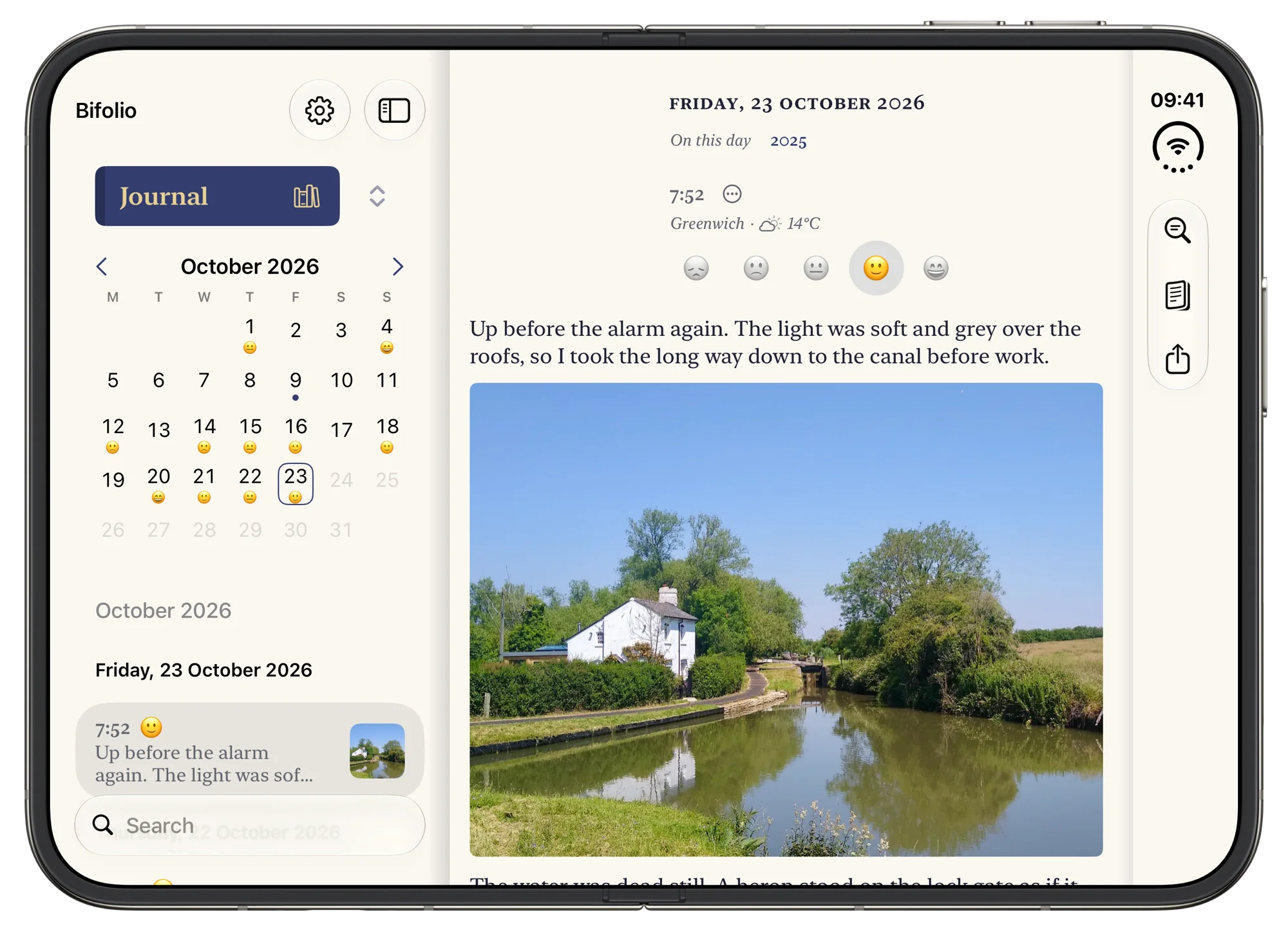 Bifolio open on an iPhone Duo: the month’s calendar and the day’s entries on the left leaf, Friday 23 October on the right, with a photograph of a lock cottage by a canal.
